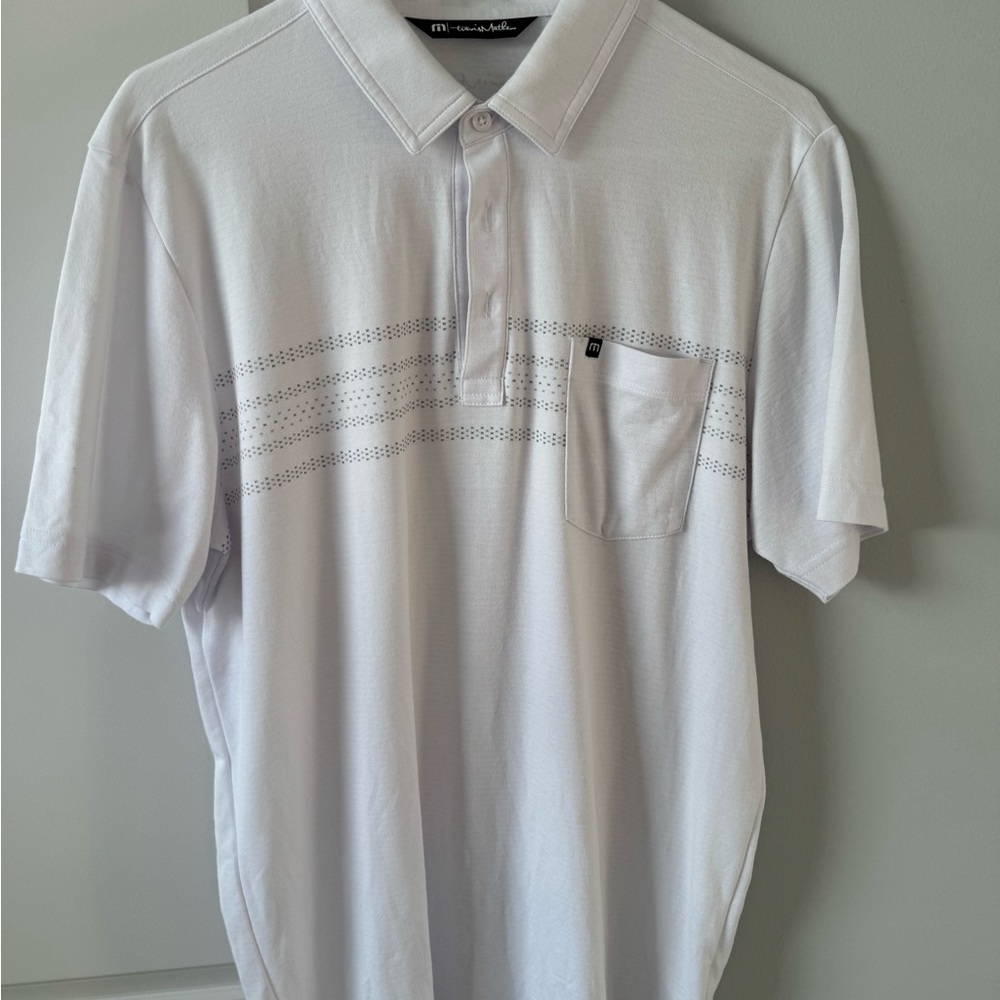 One men’s white Travis Mathew golf shirt, size medium